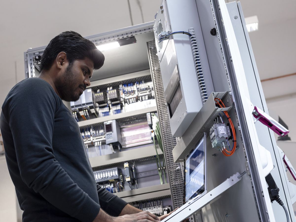 Employee at a modernized test station